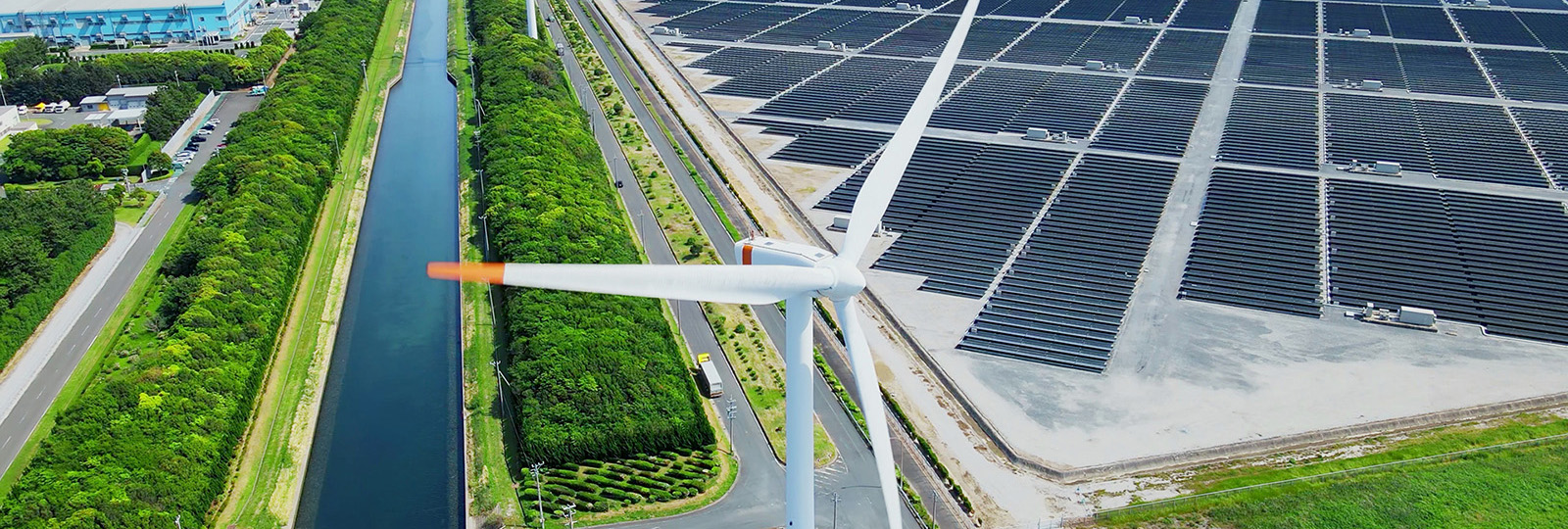 Solar power plant and Windmills aerial view. Renewable energy. Green tech.